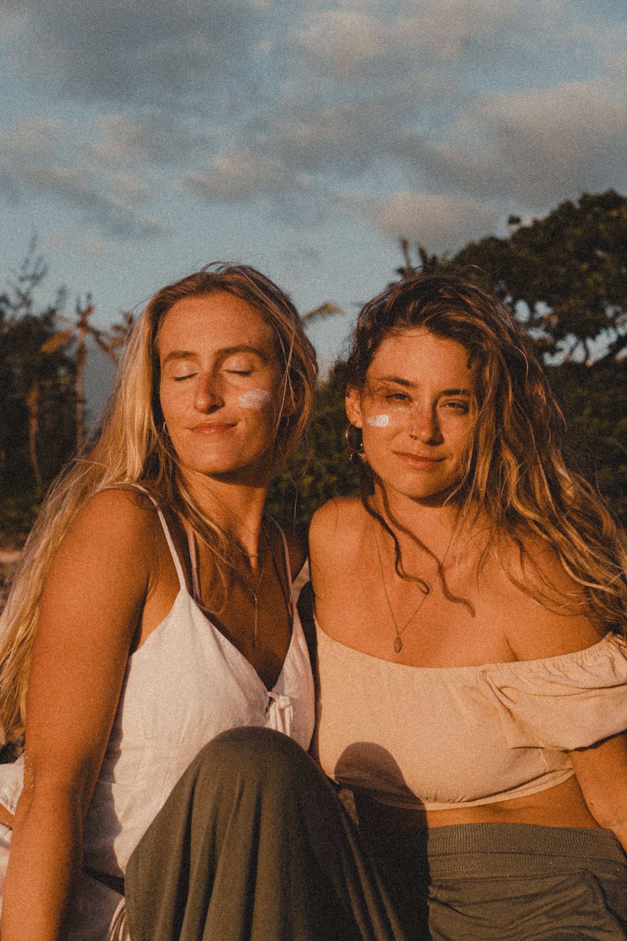 Two women at sunset wearing Ritual Organics tallow sun balm
