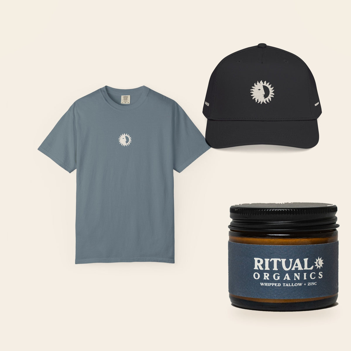 The Full Ritual: Eclipse Tee in Ice Blue, the All Black Shine On Cap, and Whipped Tallow Sun Balm